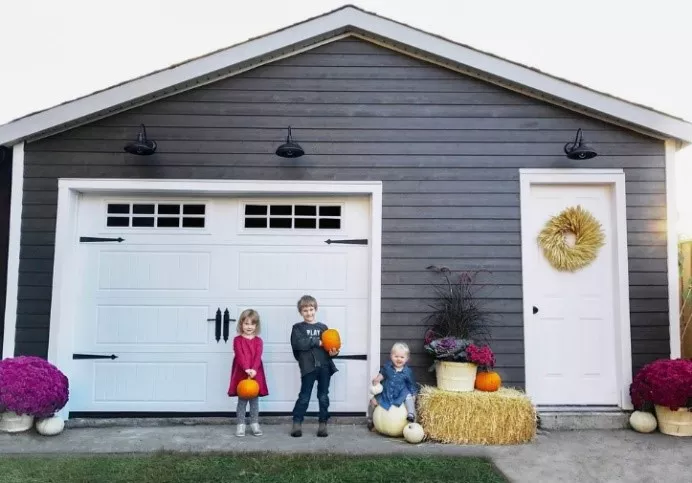 kids in front of a garage door